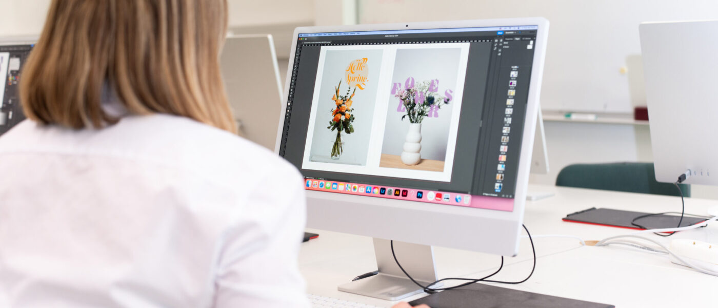 nainen opiskelee visual design